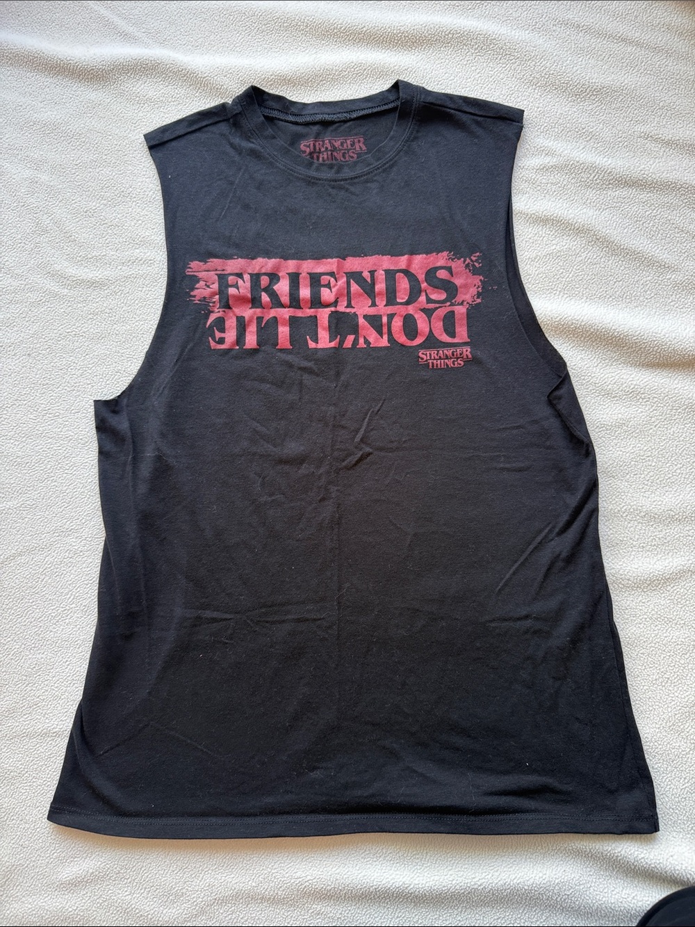 Stranger Things Black Muscle Tee with Red 'Friends Don't Lie' Graphic